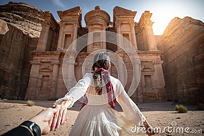 Asian woman tourist holding hand in Petra, Jordan Stock Photo