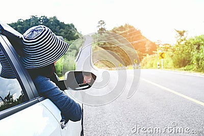 Asian woman traveler with car on beautiful road Stock Photo