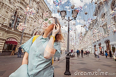 asian woman traveler posing at the Arbat street in Moscow Stock Photo