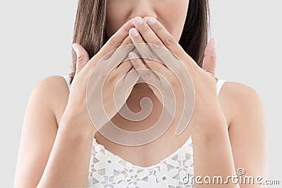 Asian woman use both hands close mouth for not commenting Stock Photo
