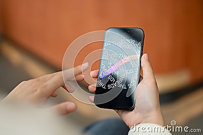 An Asian woman using Threads application on her iPhone14 while relaxing in a coffee shop Editorial Stock Photo