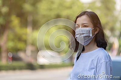 Asian women wear masks to protect The PM 2.5 pollution Stock Photo