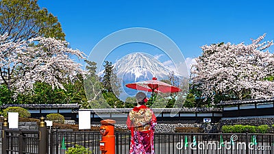 Asian woman wearing japanese traditional kimono at Fuji mountain and cherry blossom in spring, Fujinomiya in Japan Stock Photo