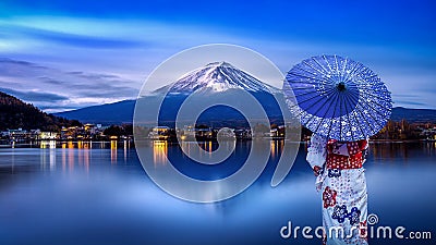 Asian woman wearing japanese traditional kimono at Fuji mountain, Kawaguchiko lake in Japan Stock Photo