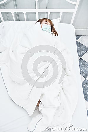 Sick woman lying on the bed. Stock Photo