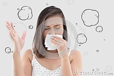 Asian woman in white dress catch her nose because of a bad smell Stock Photo