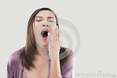 Asian woman yawning. Stock Photo
