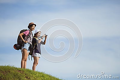 Asian women backpack take a photo Stock Photo