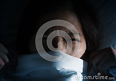 Asian women having trouble about getting up early morning. Stock Photo