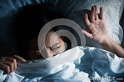 Asian women having trouble about getting up early in the morning Stock Photo