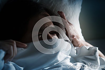 Asian women having trouble about getting up early in the morning Stock Photo