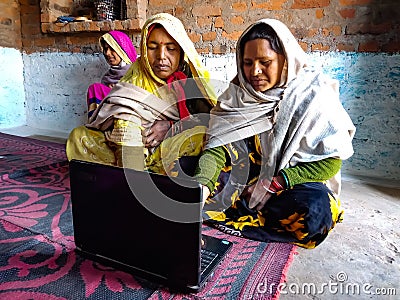 asian women learning about laptop technology togather at village home in india January 2020 Editorial Stock Photo