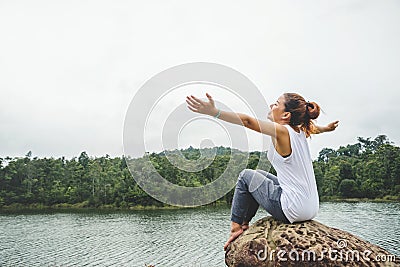 Asian women relax in the holiday. In the natural atmosphere, mountain forest Stock Photo