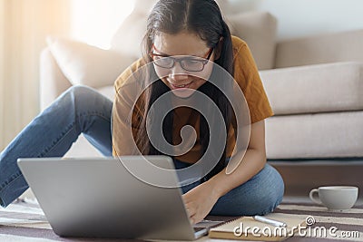 Asian women sitting using laptops at home Stock Photo