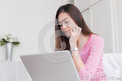 Asian women stressful working with a computer for a long time Stock Photo