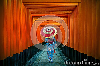 Asian women in traditional japanese kimonos at Fushimi Inari Shrine in Kyoto, Japan. Stock Photo