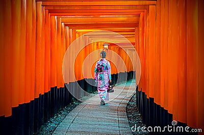 Asian women in traditional japanese kimonos at Fushimi Inari Shrine in Kyoto, Japan Stock Photo