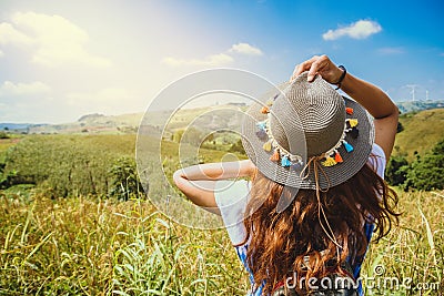 Asian women travel relax in the holiday. Stand natural touch mountain field. Thailand Stock Photo