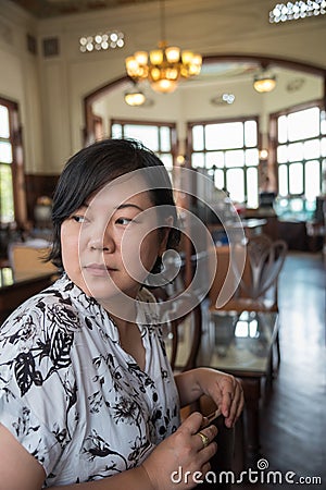 Asian women turn face in coffee shop vintage style Stock Photo