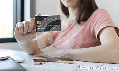 Asian women use a credit card to pay through online purchases, Payment by credit card or online banking, Shopping and mail Stock Photo