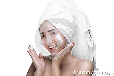 Asian women use a facial foam to wash cosmetics off the face Stock Photo