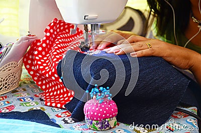 Asian women use machine sewing clothes Stock Photo