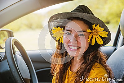 Asian women are on vacation. Drive happily traveling to the Mexican sunflower flower garden in Thailand Stock Photo