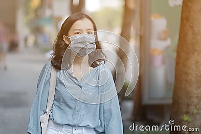 Asian women wear masks to protect The PM 2.5 pollution Stock Photo