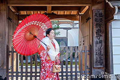 Asian women wearing japanese traditional kimono visiting the beautiful in Kyoto Stock Photo