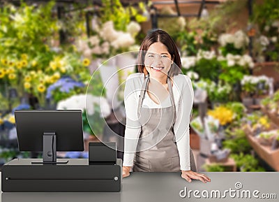 Asian worker with cashier desk Stock Photo