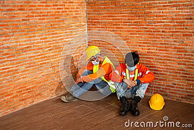 Asian workers construction wear protective face masks for safety are worrying about unemployment in construction site Stock Photo