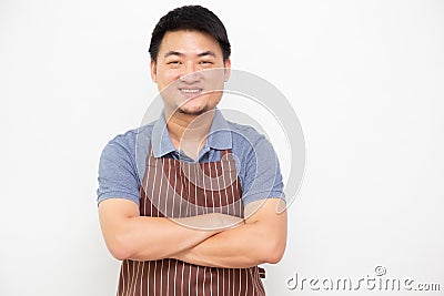 Asian workers fresh market with brown apron standing with arms crossed isolated on white background Stock Photo