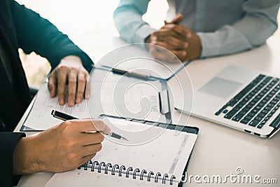 Asian young adult sitting at desk across from manager being interviewed job interview in business room Stock Photo