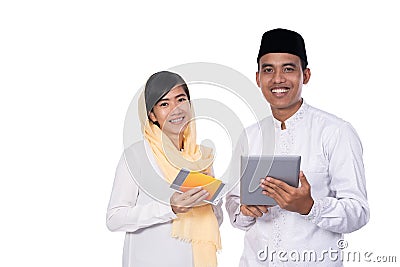 Asian young couple muslim using tablet pc Stock Photo