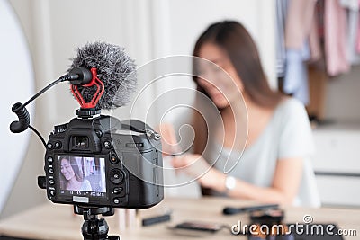 Asian young female blogger recording vlog video with makeup cosmetic at home online influencer on social media Stock Photo