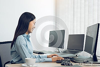 Asian young female programmer working developer programing on a computer code at office Stock Photo