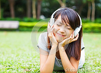 Asian young girl enjoy listen to music Stock Photo