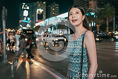 Girl night out walking on the road in dark urban Stock Photo