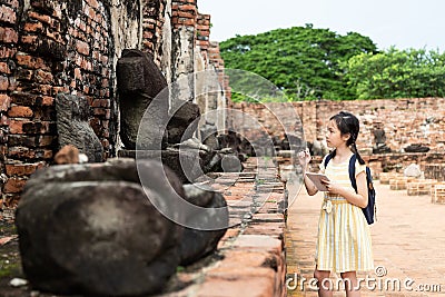 Asian young girl is study and learning antiquities,field trip,A Stock Photo