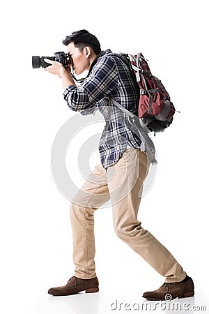 Asian young male backpacker take a picture Stock Photo