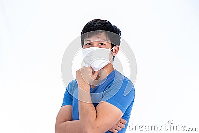 Asian young man in blue t-shirt top and medical mask to protect COVID-19 with isolated on white background concept Stock Photo