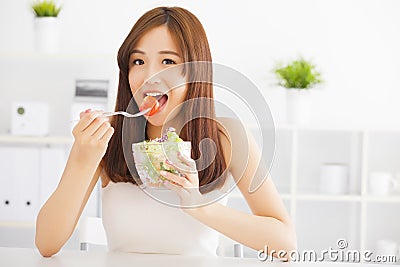 Asian young woman eating healthy food Stock Photo