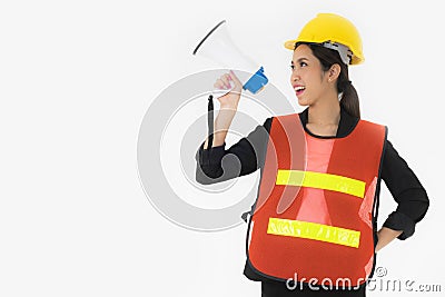 Asian young woman engineers Orange reflective safety vest for working safety and Yellow Safety helmet Standing and holding a Stock Photo