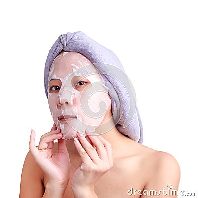 Asian young woman face, girl applying facial peel off mask Stock Photo