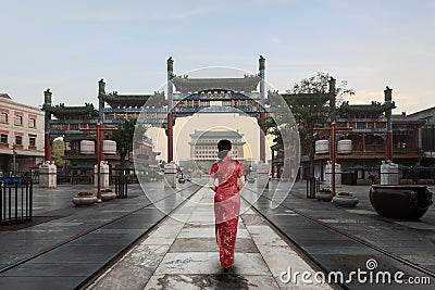 Asian young woman in old traditional Chinese dresses in Hutong village in Beijing, China Editorial Stock Photo