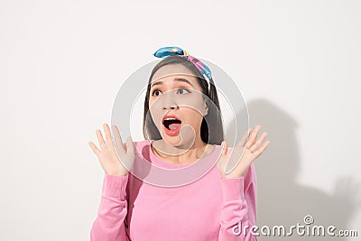 Asian Young Woman in Surprising Emotion, Face Look up above with opened mouth and hands, Emotional of Female Concept, Front view Stock Photo