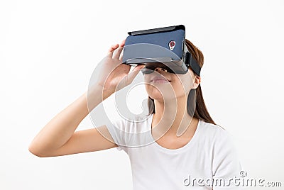 Asian young woman using virtual reality headset Stock Photo