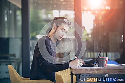 Asian younger freelance working in home office Stock Photo