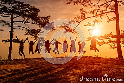 Asians traveler jumping in happy time at Phu Kradueng National Park at Sunset in Loei Province of thailand Stock Photo