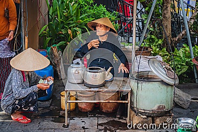 Asiatic woman take her lunch in an asiatic market. Editorial Stock Photo